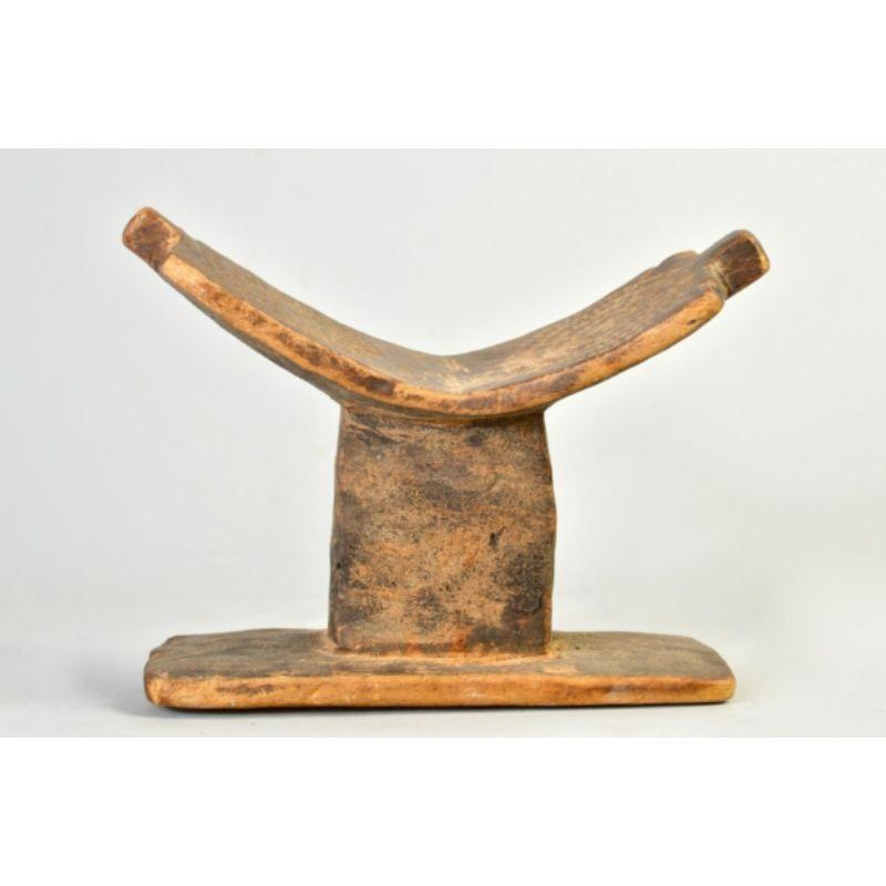 Amyas Naegele Dogon/Tellem headrest with twin sun bursts in wood

Dogon/Tellem headrest with incised sun burst designs on the saddle ca.16th century or earlier. This piece is similar to an example at the Smithsonian National Museum of African Art