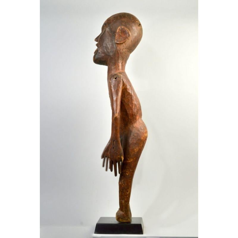 Tanzanian Amyas Naegele Sukuma Figure with Articulated Arms in Wood For Sale