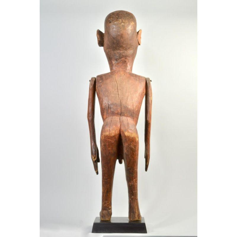 Carved Amyas Naegele Sukuma Figure with Articulated Arms in Wood For Sale