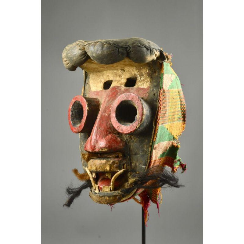 Wé Mask in Wood

This Teé Gla (bravery mask) from Western Côte d’Ivoire is embellished with fiber-filled textile balls simulating medicinal pouches and amulets worn by hunters for protection. It is my belief that these medicinal balls and pouches we