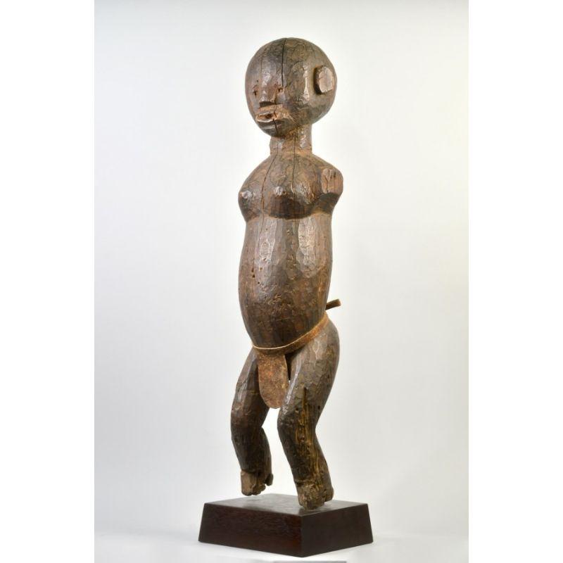 Amyas Naegele Young Female Sukuma Figure in Wood

Young female Sukuma figure wearing a leather skirt. This figure would have been carried in a ritual performance. There is some no longer active insect damage rising from the bottom of the piece,
