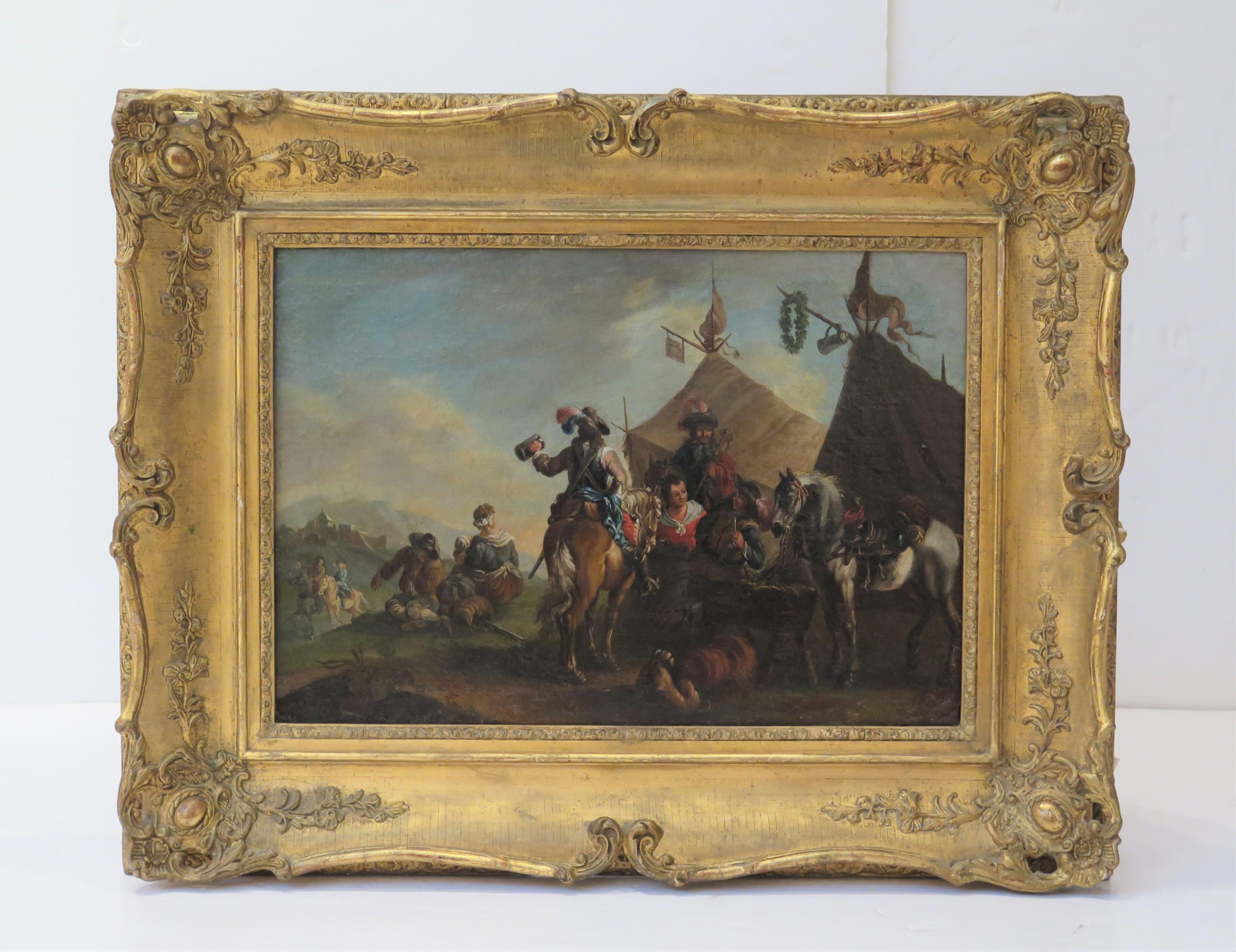 A 17th century oil on canvas picture, framed, a scene of travelers / noblemen including horses after Philips Wouwerman ( Dutch, 1619-1668 ), noblemen on horseback are drinking ale / beer and smoking pipes at what appears to be a tavern tent with