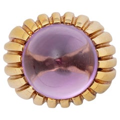 An 18 Carat Gold and Cabochon Cut Amehtyst Fred Ring
