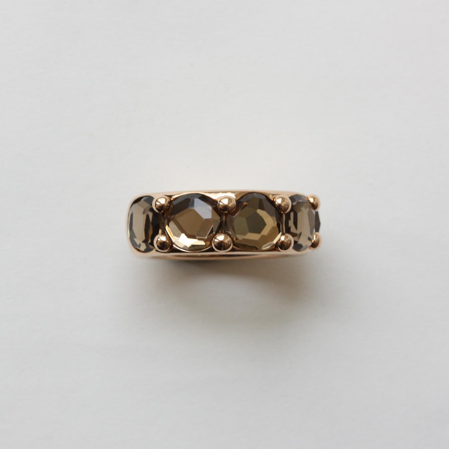 An 18 carat gold band ring set with 5 quartzes  signed: ring Pomellato, model Narciso, numbered: C900015305, size: 53.
