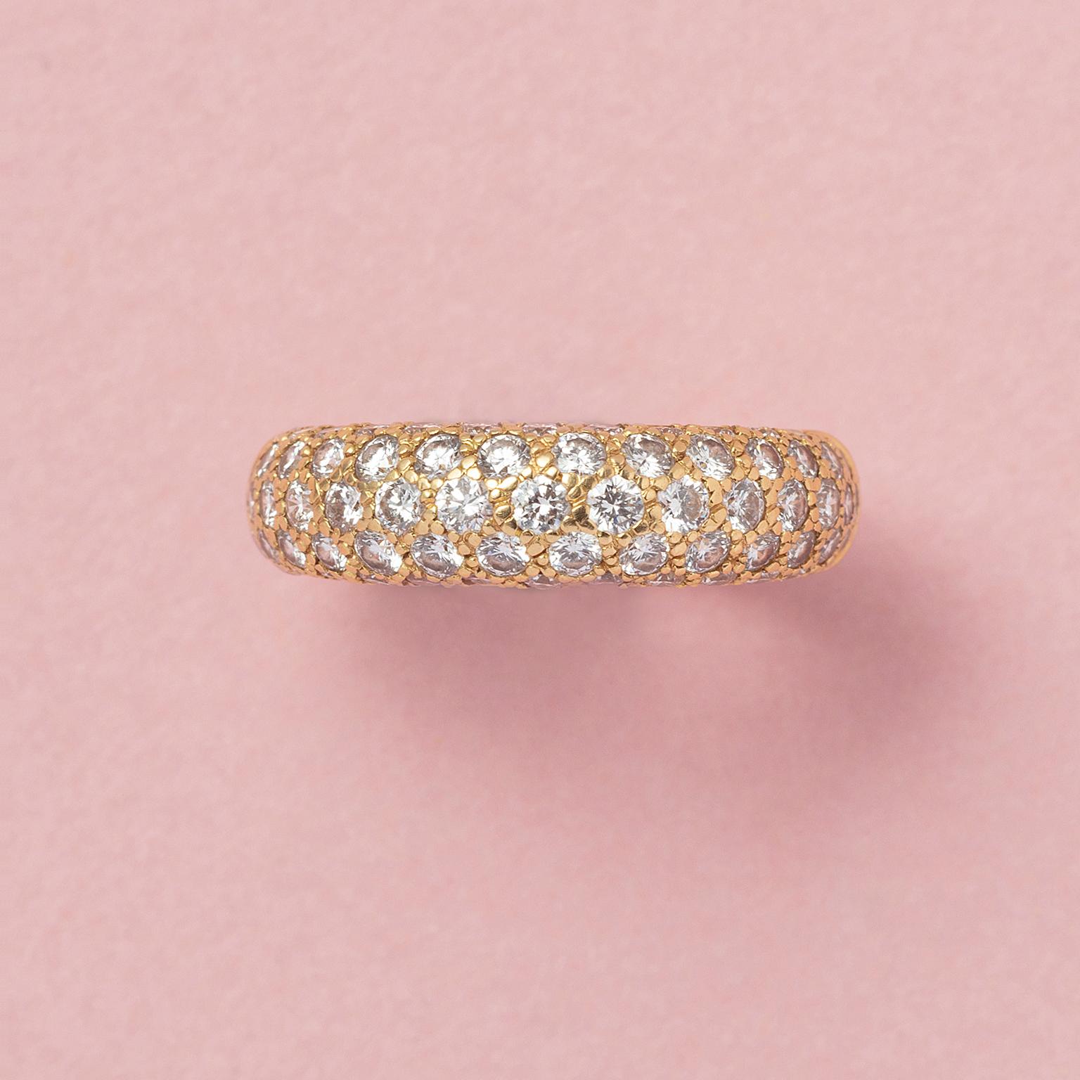 An 18 carat yellow gold band ring pavé set with 69 brilliant cut diamonds descending in size divided over five rows (app. 1.33 carat, D-F in color, VS clarity), signed and numbered: Cartier, 11150B model: Étincelle.

weight: 6.53 grams
size: 16.5 mm