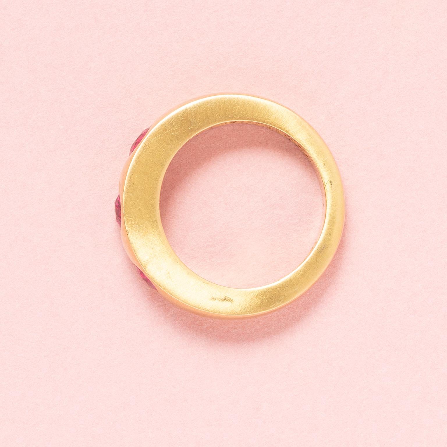 Women's or Men's An 18 Carat Gold Band Three Stone Ring with Rubies For Sale