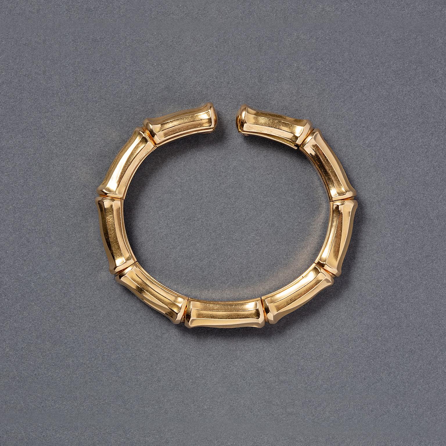 An 18 carat yellow gold Cartier bracelet in the shape of a stilized bamboo branch. Signed and numbered: Cartier, 648589.

weight: 52.19 grams
inner diameter: 5.2 cm
Cartier size 1, circa  15.5 cm, well fitted for  wrist size 14 - 16 cm
dimensions: