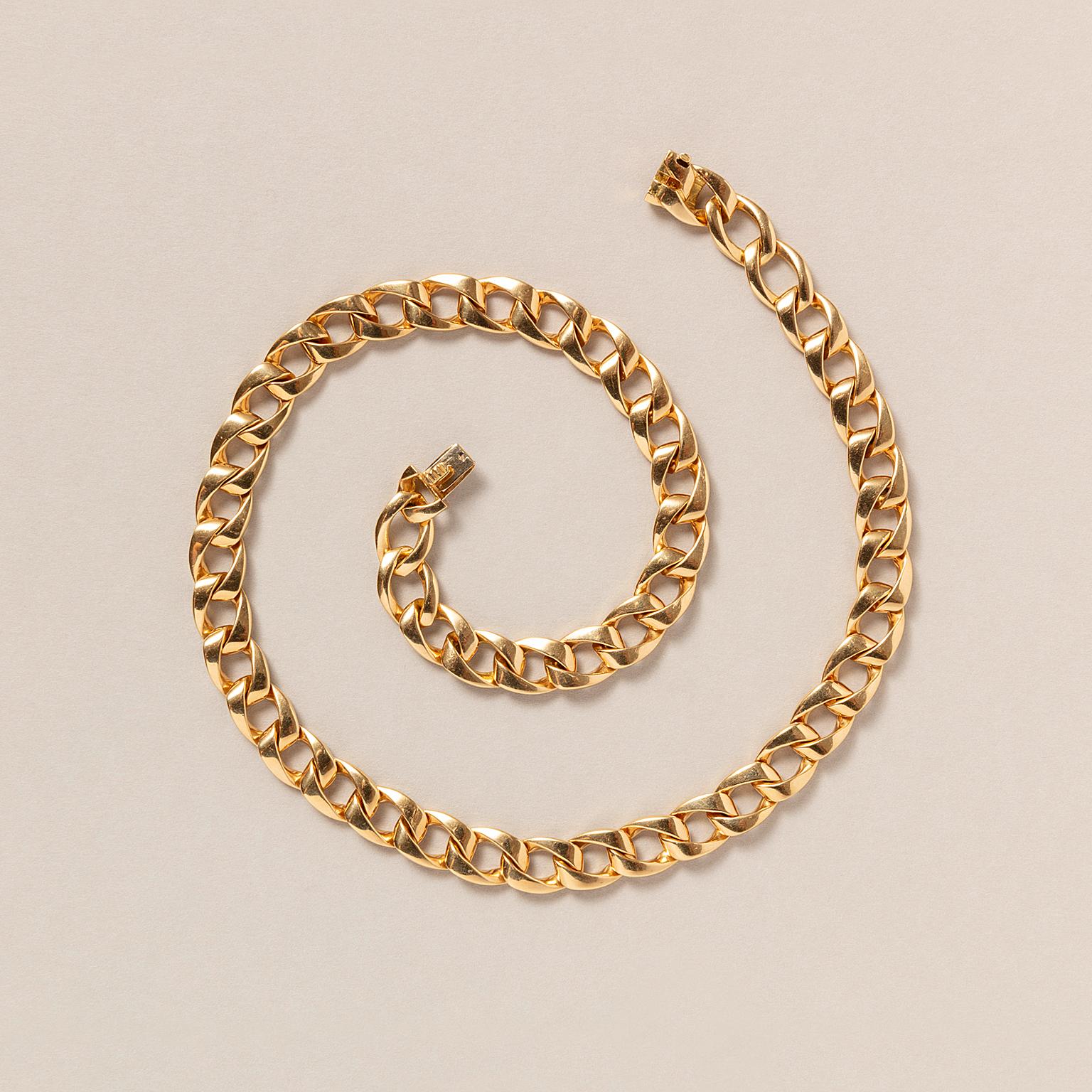 An 18 carat golden soft rounded curb link necklace, signed and numbered: Cartier, 606605, French assay marks and master mark, model Bargame, 1988.

weight: 93.3 grams
dimensions: 44.5 x 0.9 cm