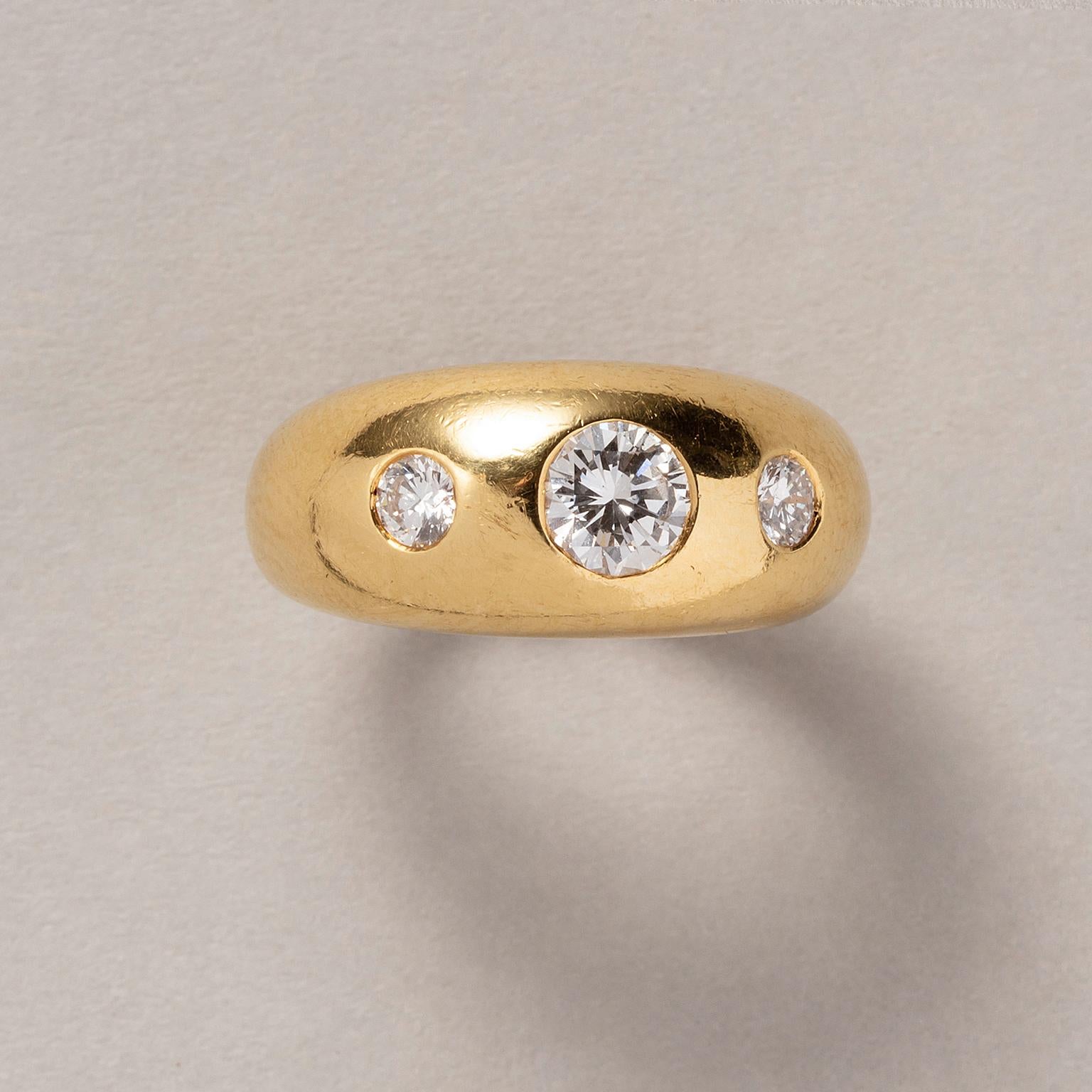 An 18 carat yellow gold dome ring set with 3 brilliant cut diamonds (circa 1.05 carat in total). Signed and numbered: Cartier, 84 BX 060.

weight: 8.38 grams
ring size: 16.5 mm / 6 US
width: 10 mm