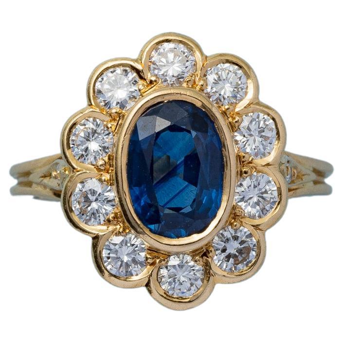 An 18 Carat Gold Cluster Ring with Sapphire and Diamond For Sale