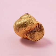 An 18 Carat Gold Cochlea Piaget Box with Ruby