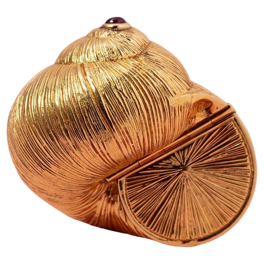 An 18 Carat Gold Cochlea Piaget Box with Ruby