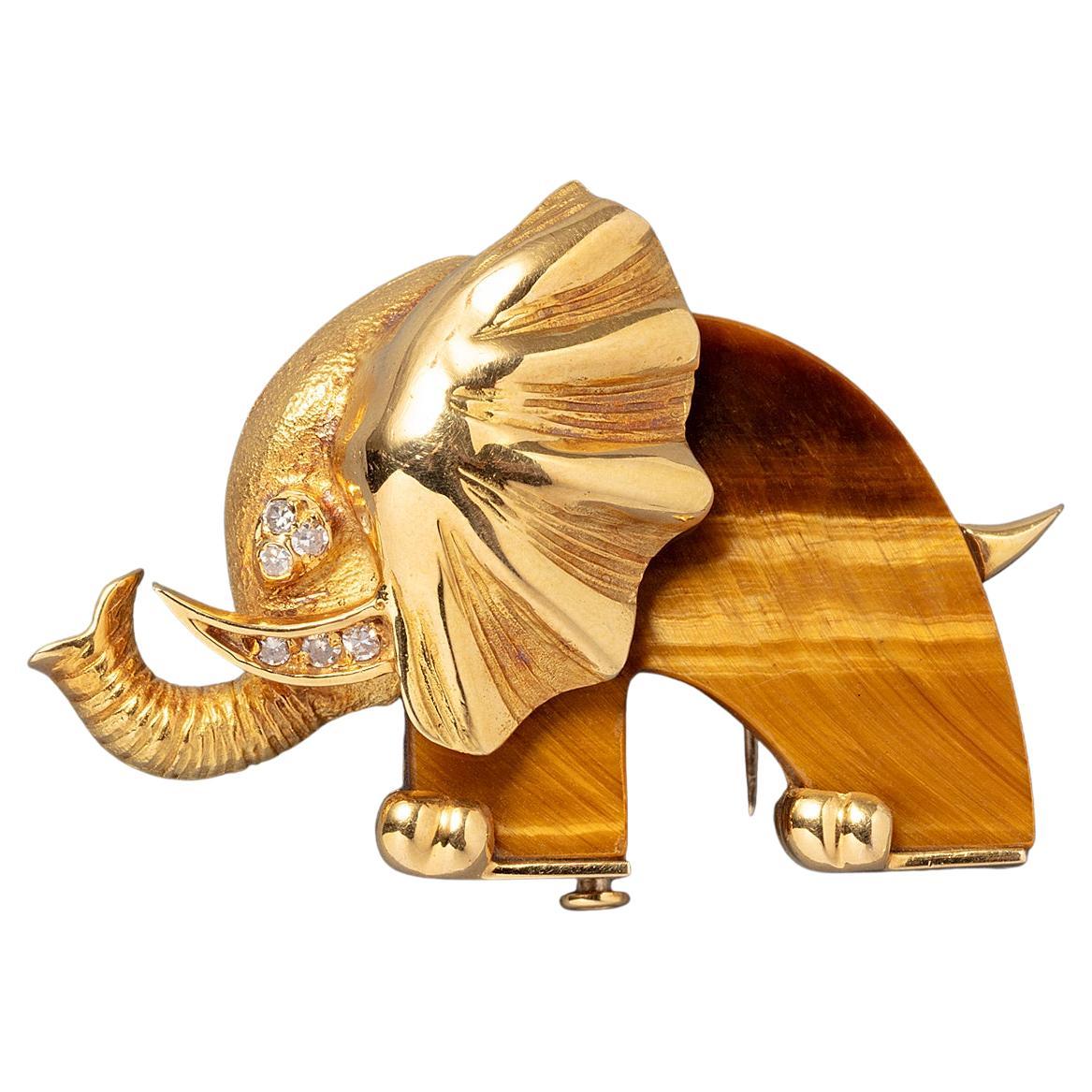 An 18 Carat Gold Elephant Brooch with Tiger Eye and Diamond
