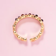 Flexibles Manschettenarmband aus 18 Karat Gold mit Edelsteinen