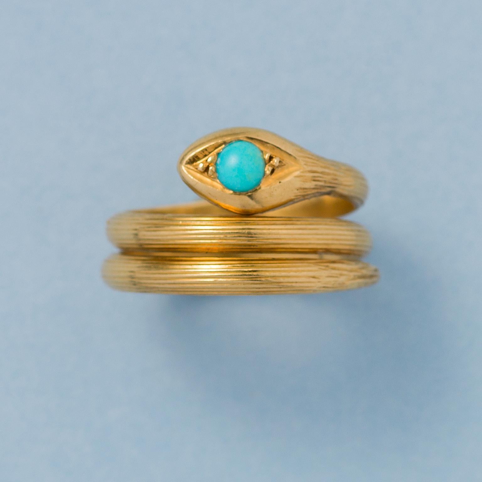 A little French snake ring 18k gold engraved vertically with stripes and a cabochon cut turquoise eye, France, circa 1910.

weight: 5.97 grams
ring size: 17 mm / 6.5 US
width: 1.2 cm