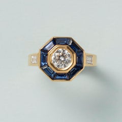 An 18 Carat Gold Mellerio Gold Ring with Diamond and Sapphire