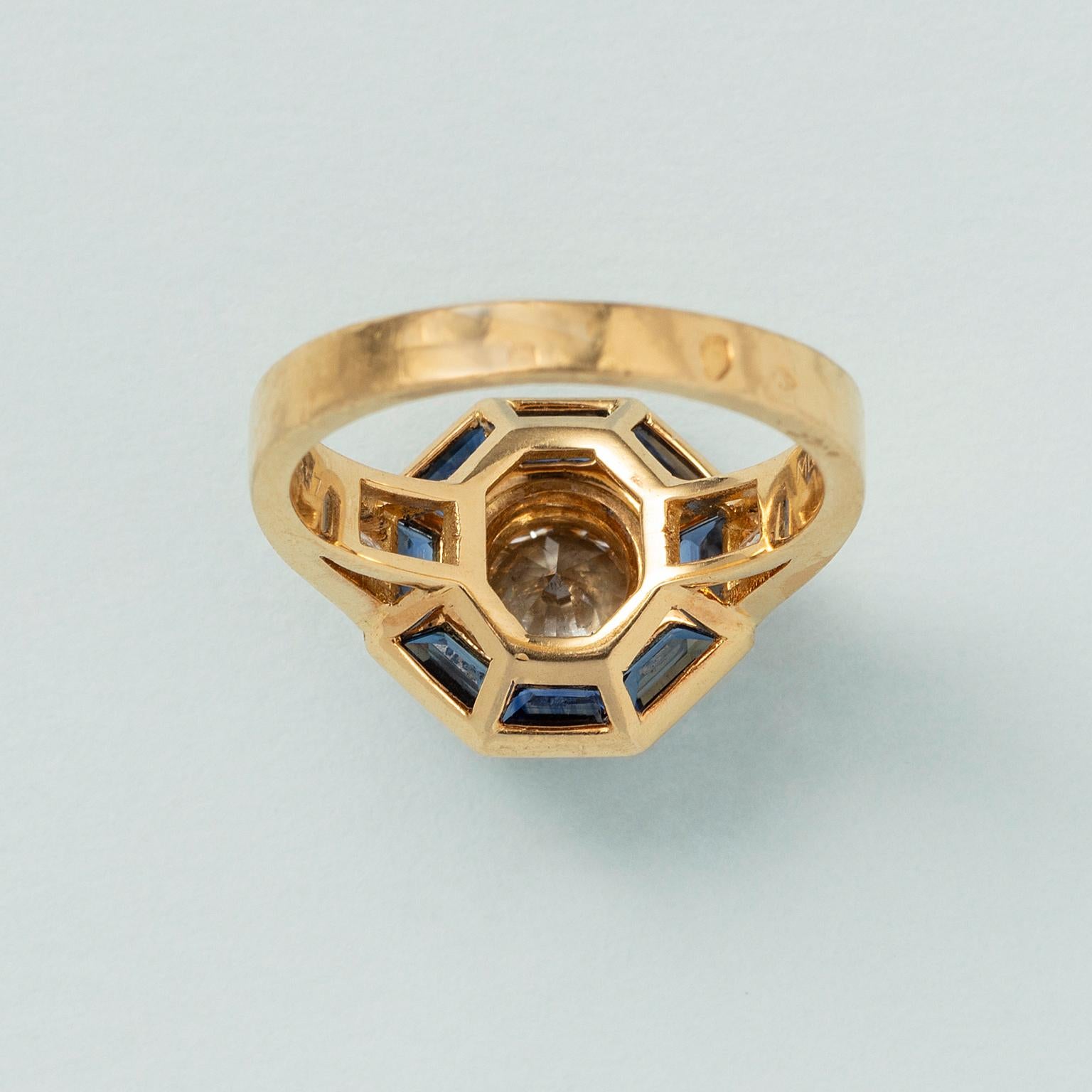 Women's or Men's An 18 Carat Gold Mellerio Gold Ring with Diamond and Sapphire For Sale