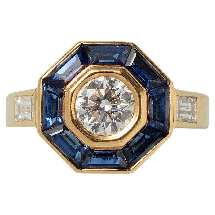 An 18 Carat Gold Mellerio Gold Ring with Diamond and Sapphire For Sale