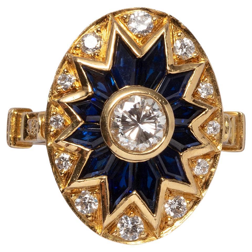 An 18 carat gold ring with diamond and sapphire