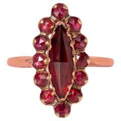 An 18 Carat Gold Ring with Garnets