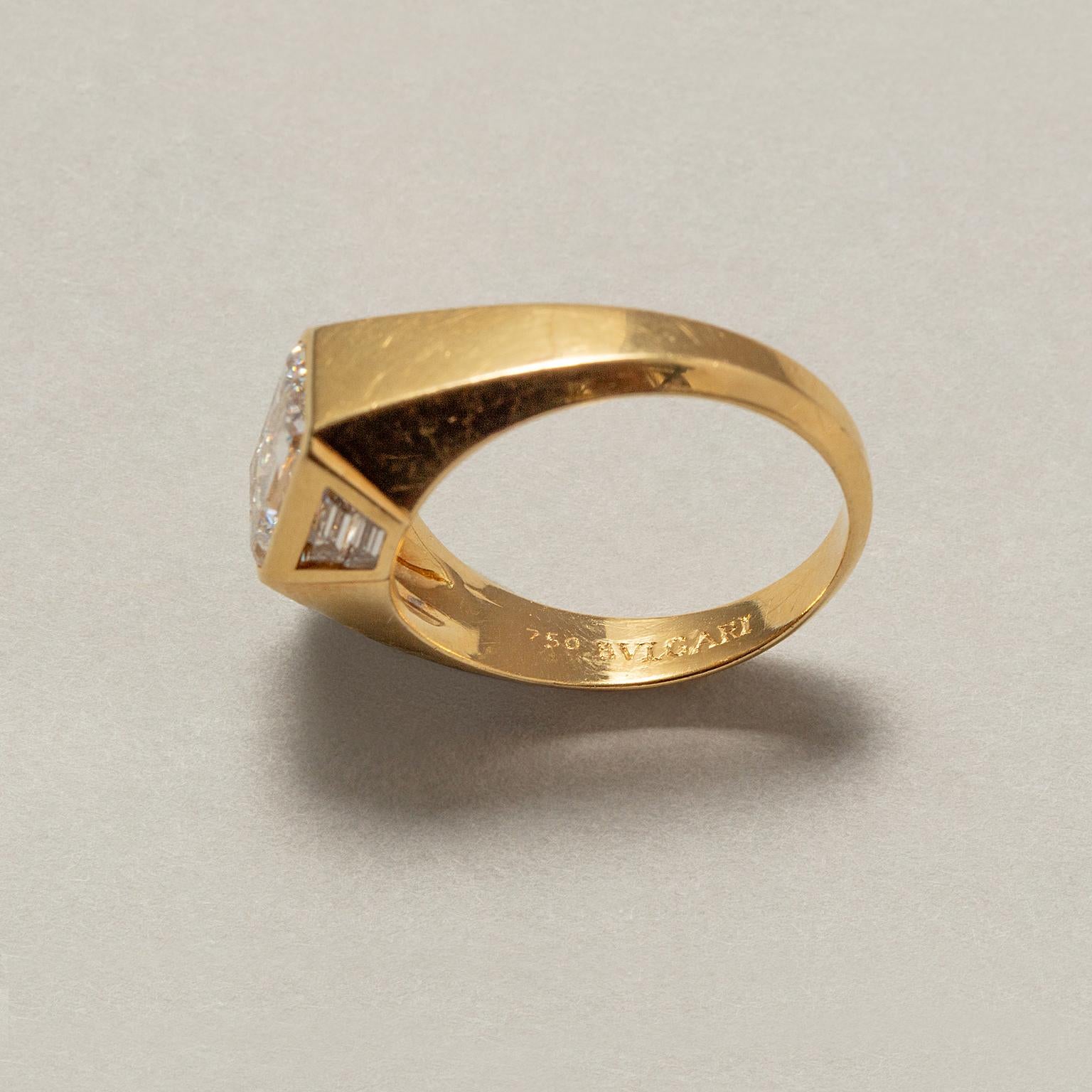 Women's or Men's An 18 Carat Gold Step Cut Diamond Bulgari Ring For Sale