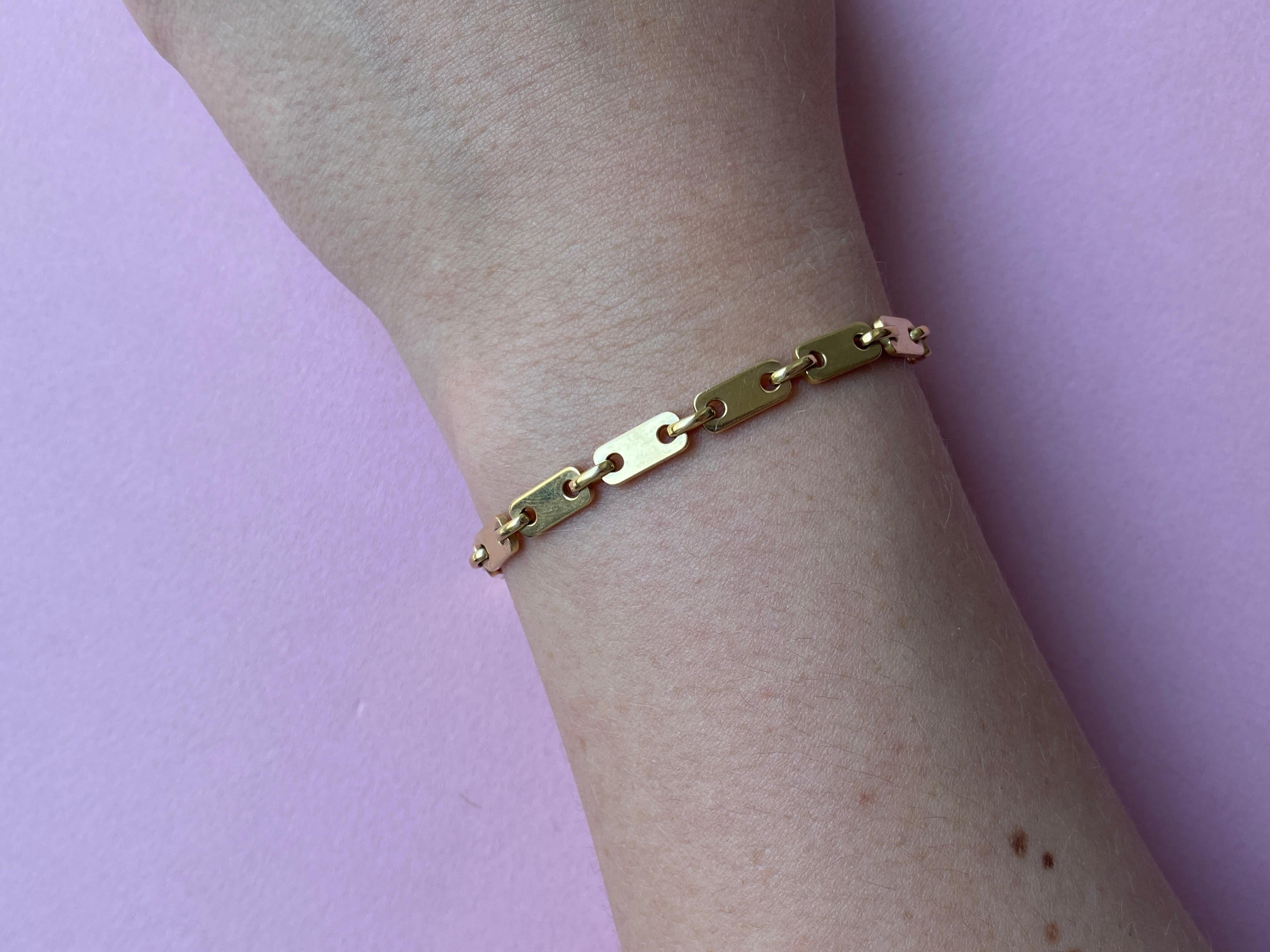 An 18 Carat Gold Tab Link Cartier Bracelet In Good Condition In Amsterdam, NL
