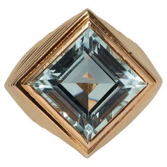 An 18 Carat Gold Tartelette Ring with Aquamarine