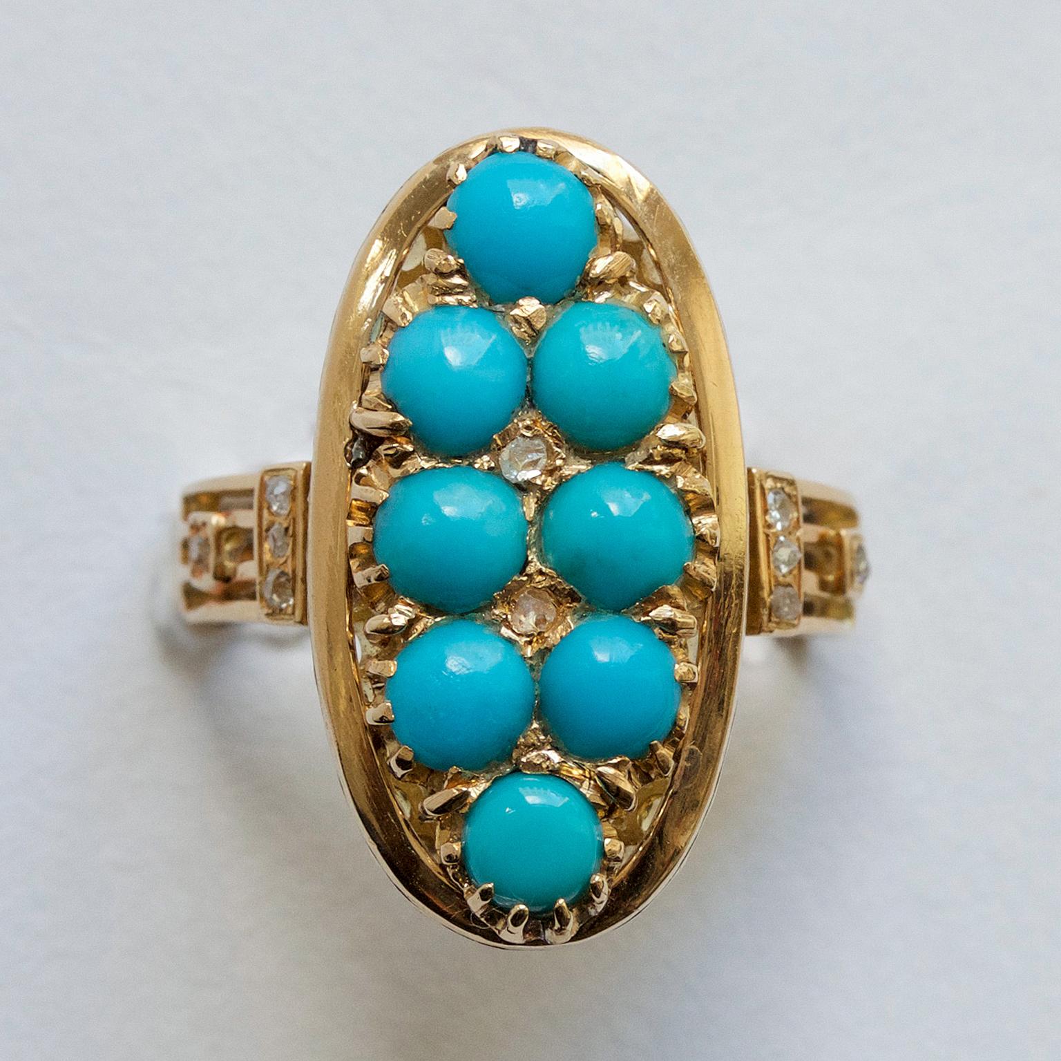 A ring with a large 18 carat yellow gold oval element set with eight cabochon cut turquoises and with six rose cut diamonds in between the turquoises and on the side of the shank, France, 19th century.

weight: 6.76 grams
width: 2.8 – 22 mm
ring