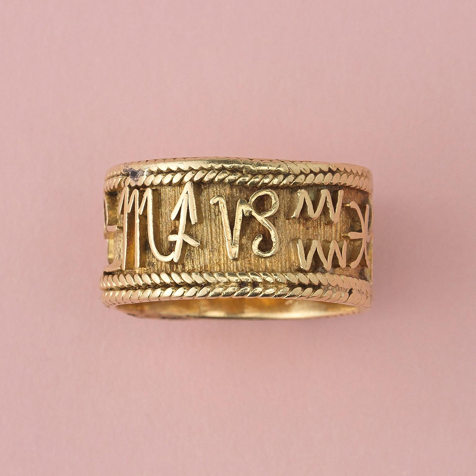 An 18 carat gold ring with all the symbols of the twelve zodiac signs around with two twisted gold wires on each end.

weight: 4.97 gram
ring size: 16.5 mm. / 6 US
width: 10 mm.
