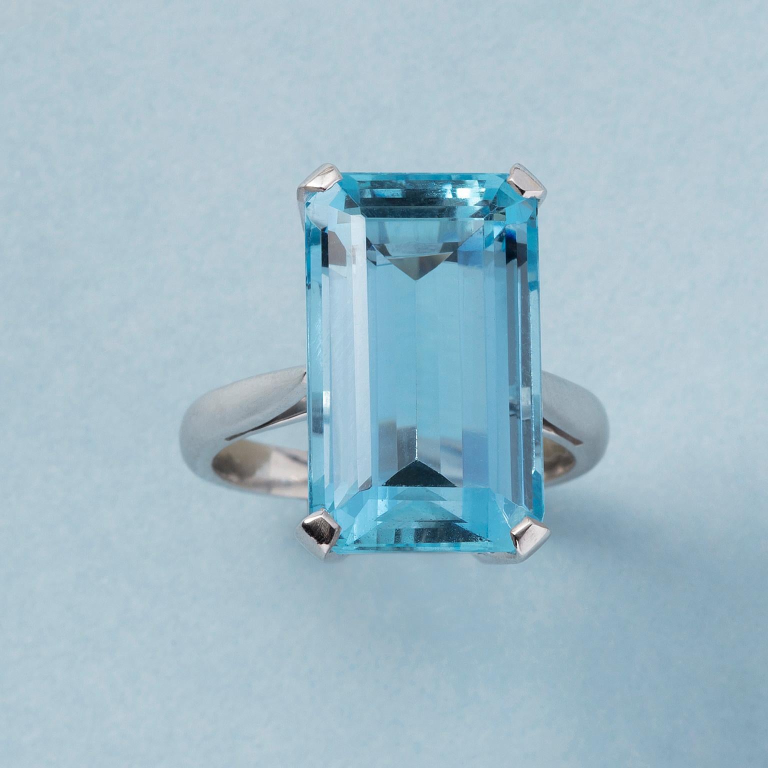 An 18 carat white gold solitaire ring set with a step cut aquamarine in flawless condition and quality (circa 14 carat), France, marked with a French aigle and half a illegible French master mark.

weight: 8.44 grams
size: 18- mm / 7 3/4 US
width: 2
