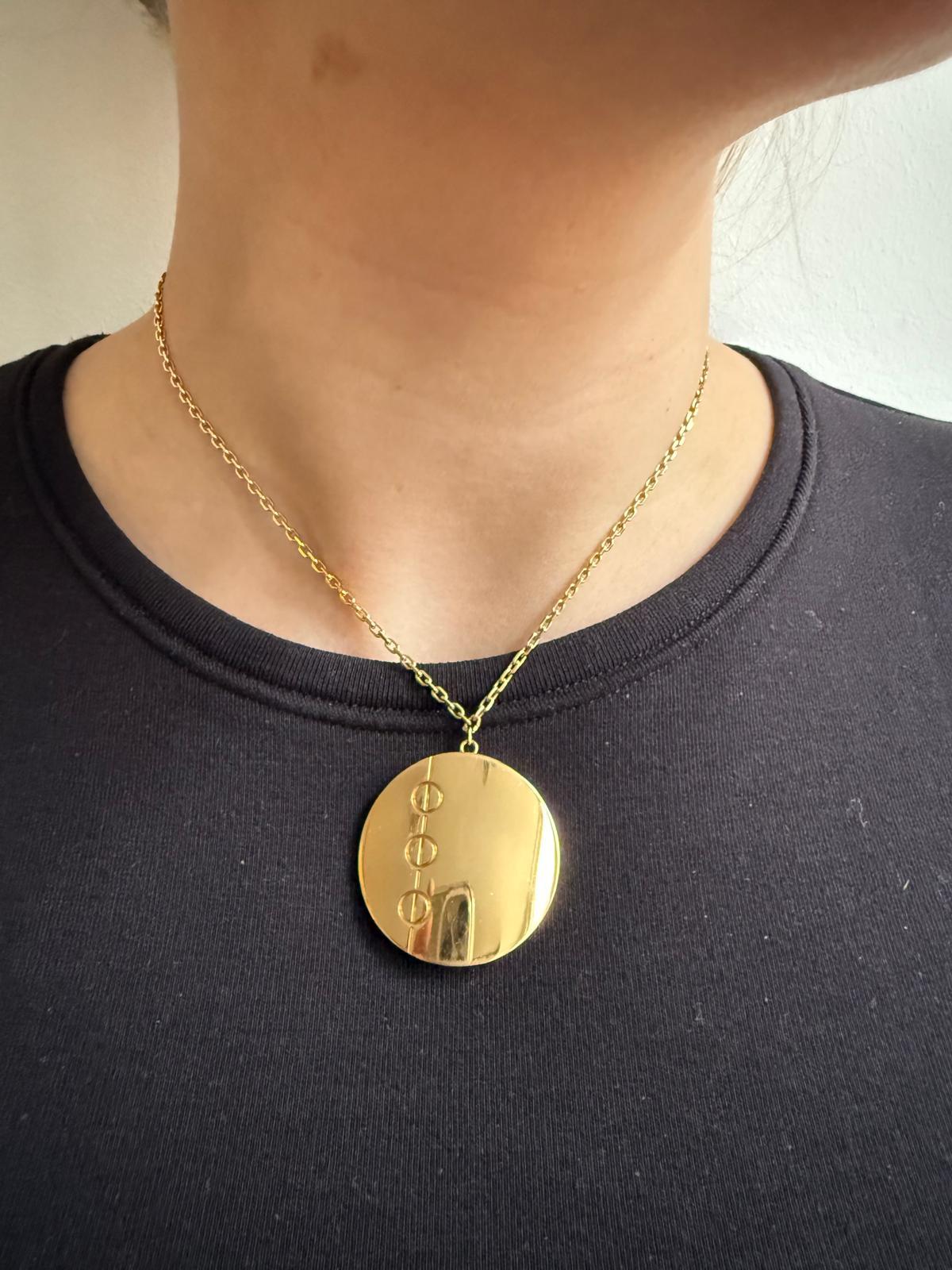 An 18 carat yellow gold Cartier love disc pendant For Sale 2