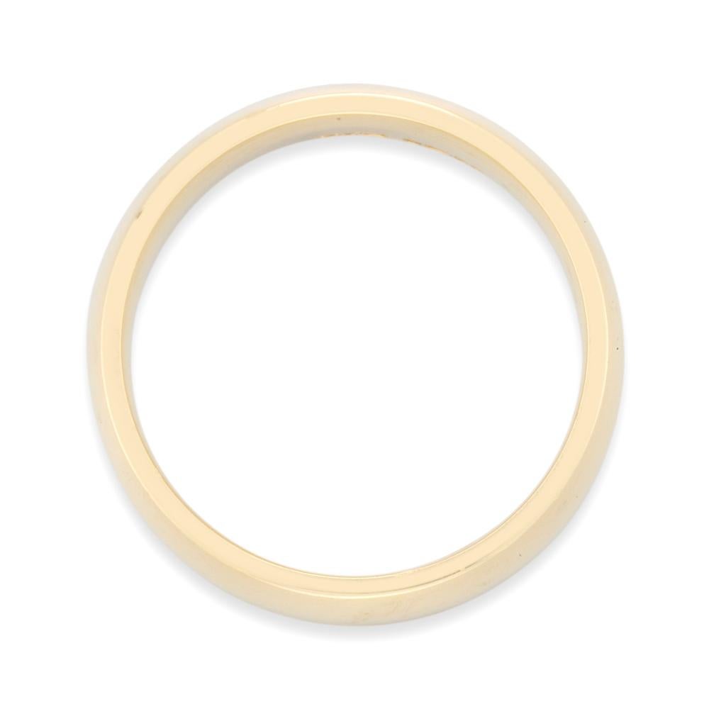 An 18 carat yellow gold wedding ring, the D-shape band 6mm in width, size Q, gross weight 10.3 grams.

This thick gold wedding band was made by Bentley & Skinner, the London jewellers by appointment to both Her Majesty the Queen and His Royal