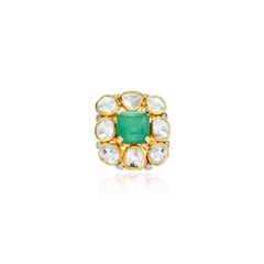 An 18 K Octagon natural emerald ring with Diamond Polki (flat uncut diamonds)