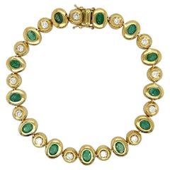 An 18 Karat Yellow Gold, Emerald and Diamond Bracelet