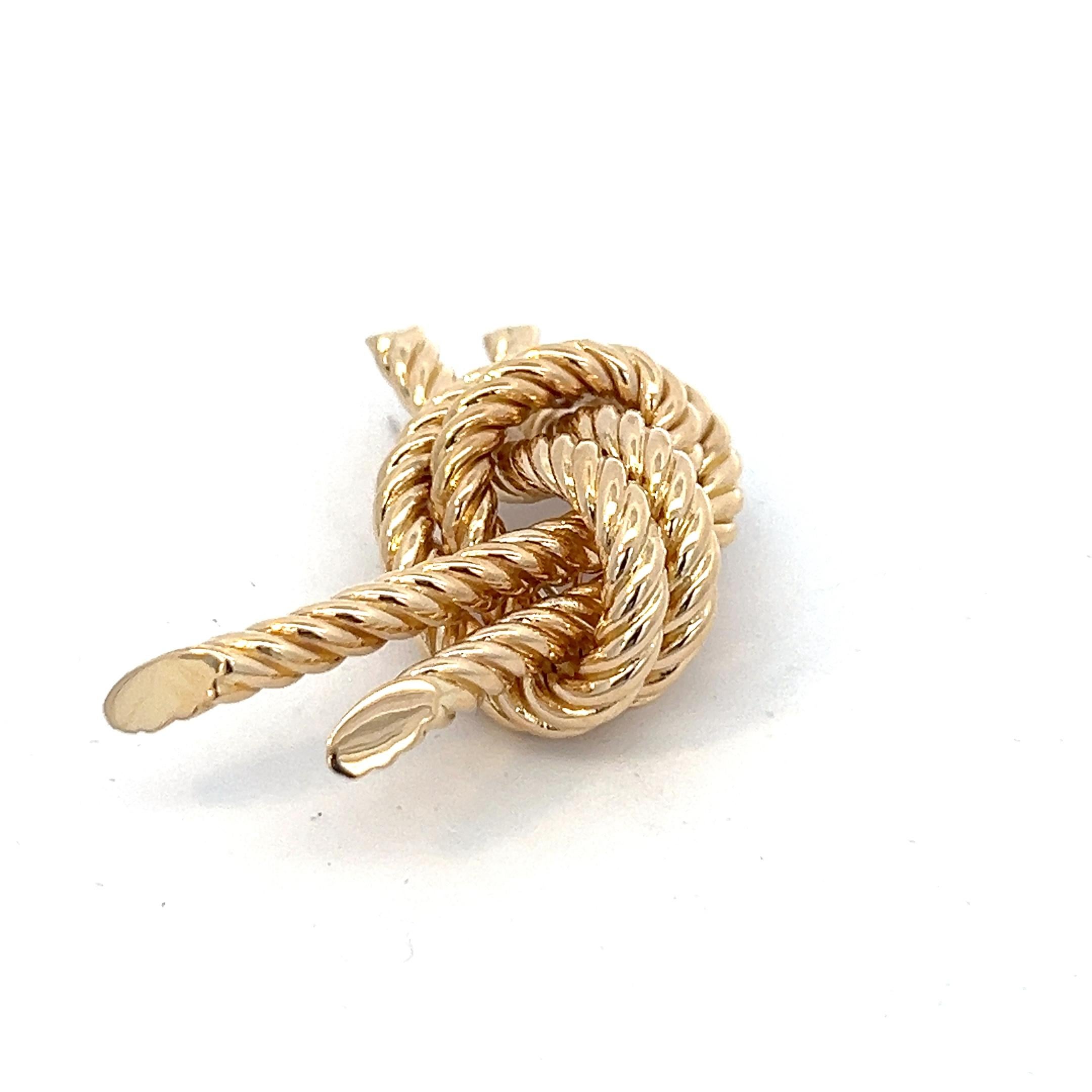 Women's or Men's An 18 karat yellow gold knot brooch by Hermès. For Sale