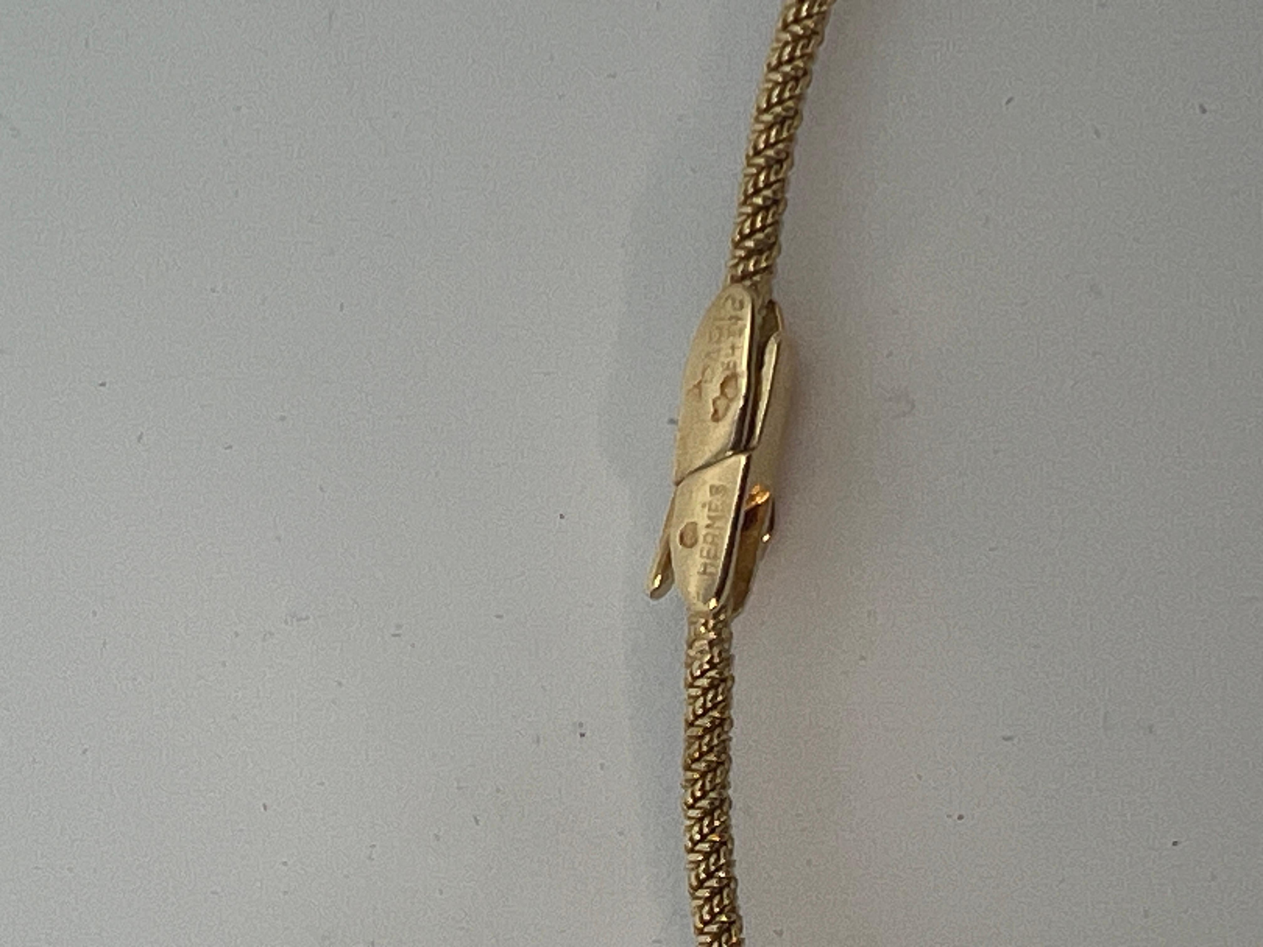 An 18 karat yellow gold necklace by Hermès. 6