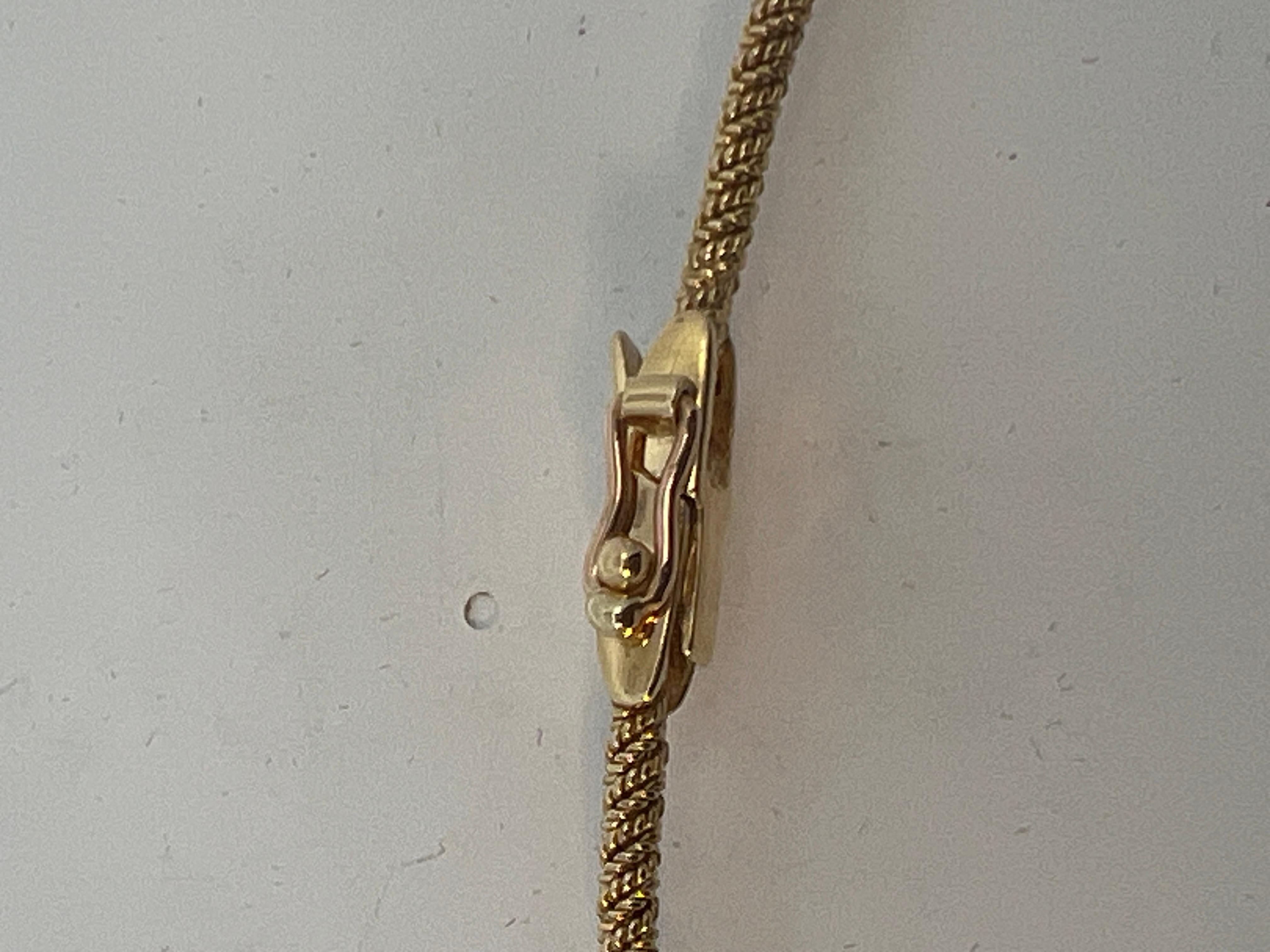An 18 karat yellow gold necklace by Hermès. 7