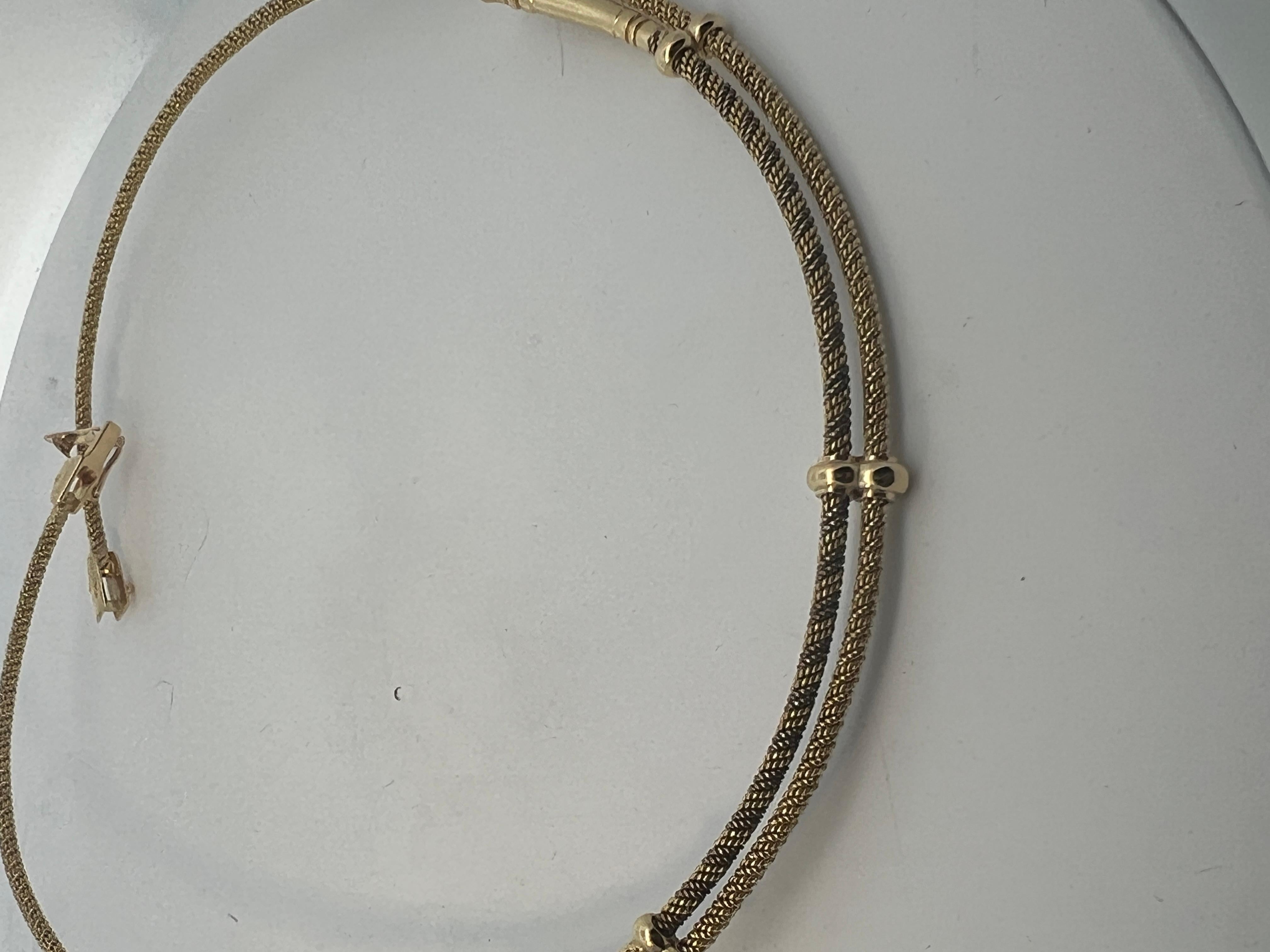 An 18 karat yellow gold necklace by Hermès. 10