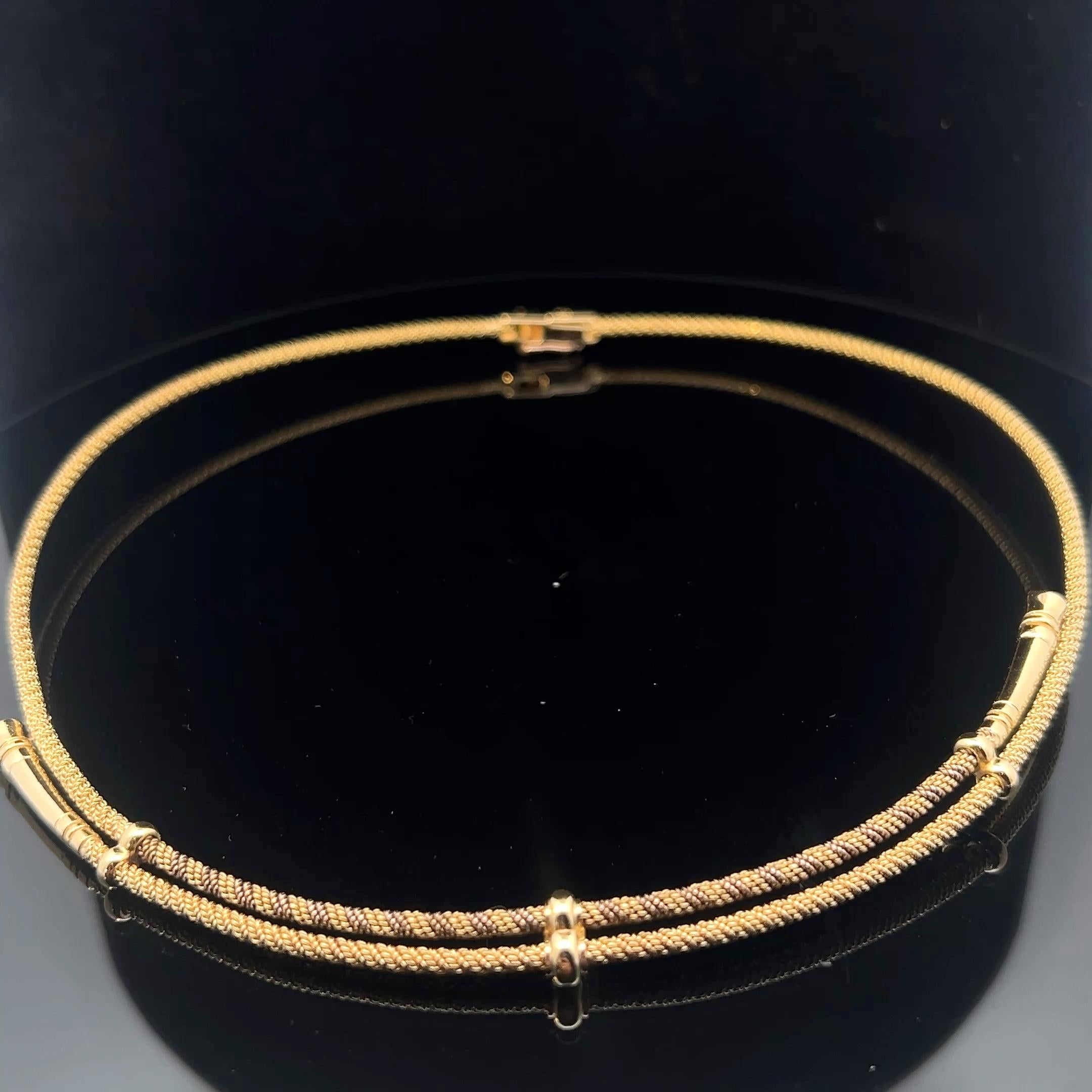 An 18 karat yellow gold necklace by Hermès. 4