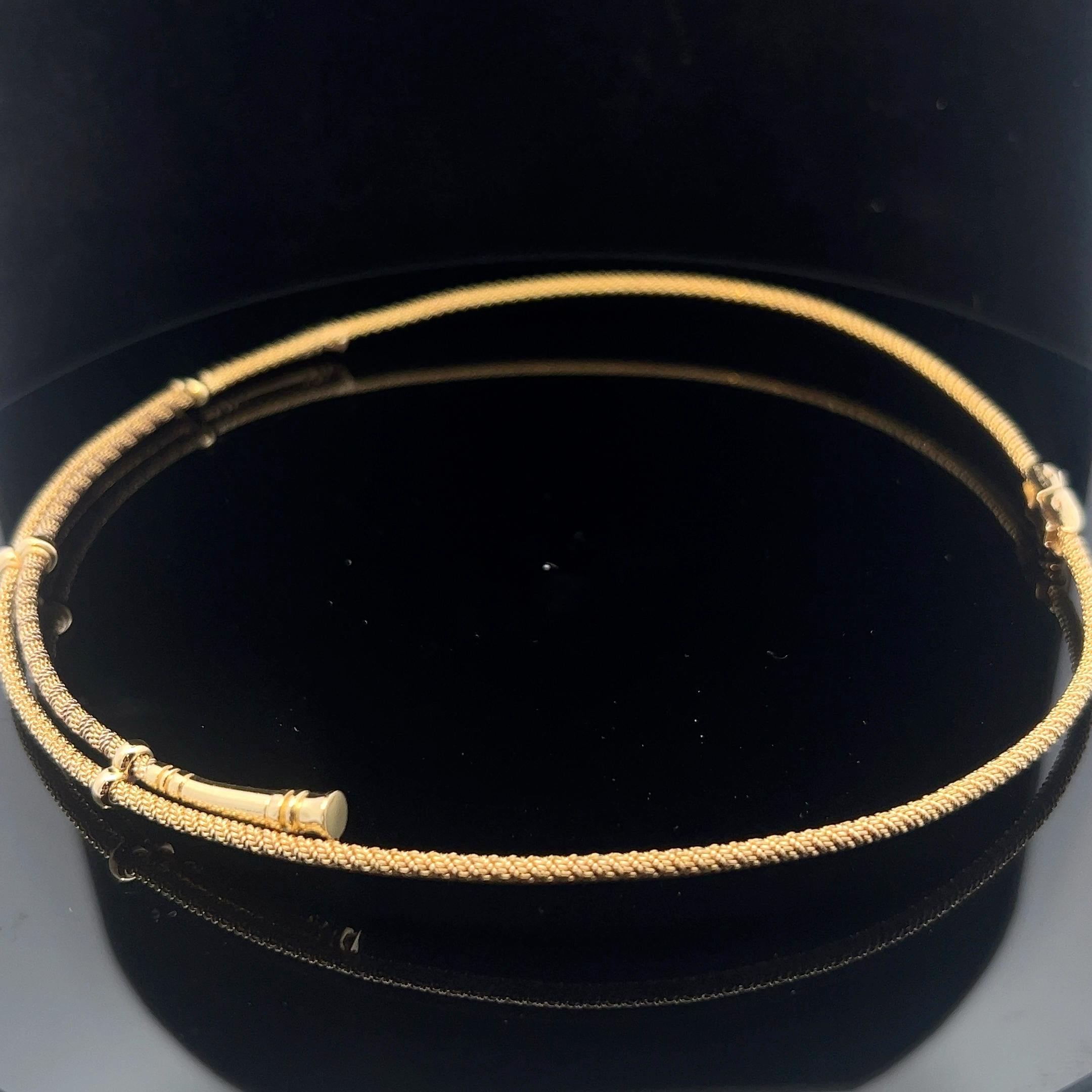 An 18 karat yellow gold necklace by Hermès. 5