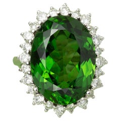 An 18 White Carat Gold Cluster Ring set with a Green Tourmaline and Diamonds 