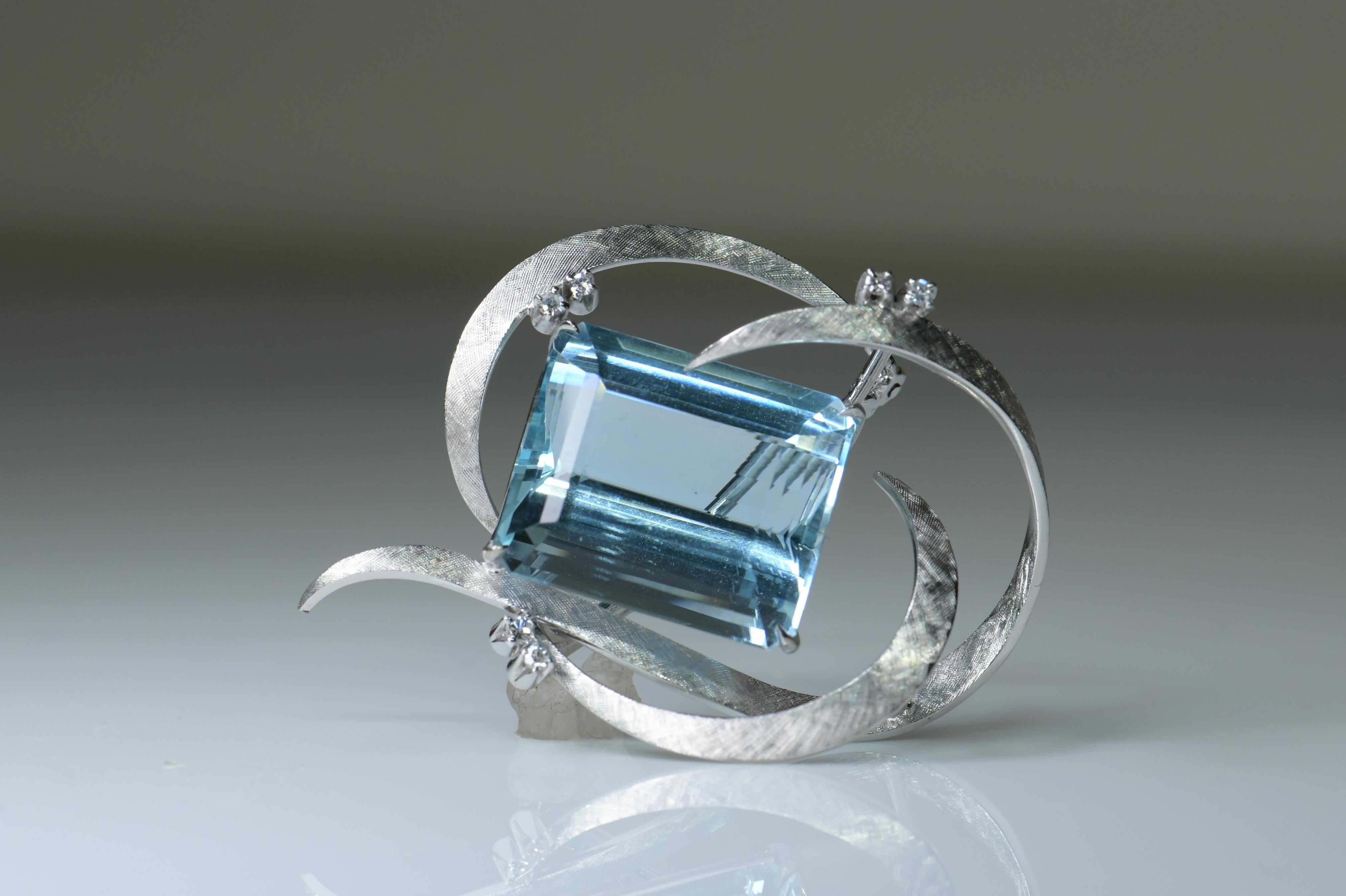 Gorgeous, 1960's brooch, composed of 18k white gold, approx. 32ct aquamarine. This fine brooch measures 39x 34mm. Genuine aquamarine measure 20x 11 x 10mm. The brooch is accented with approx. 0.5ctw of sparkly diamonds. The condition of this brooch