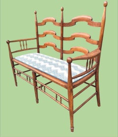 An 1890's Arts and Crafts beechwood hall seat by British designer E G Punnett