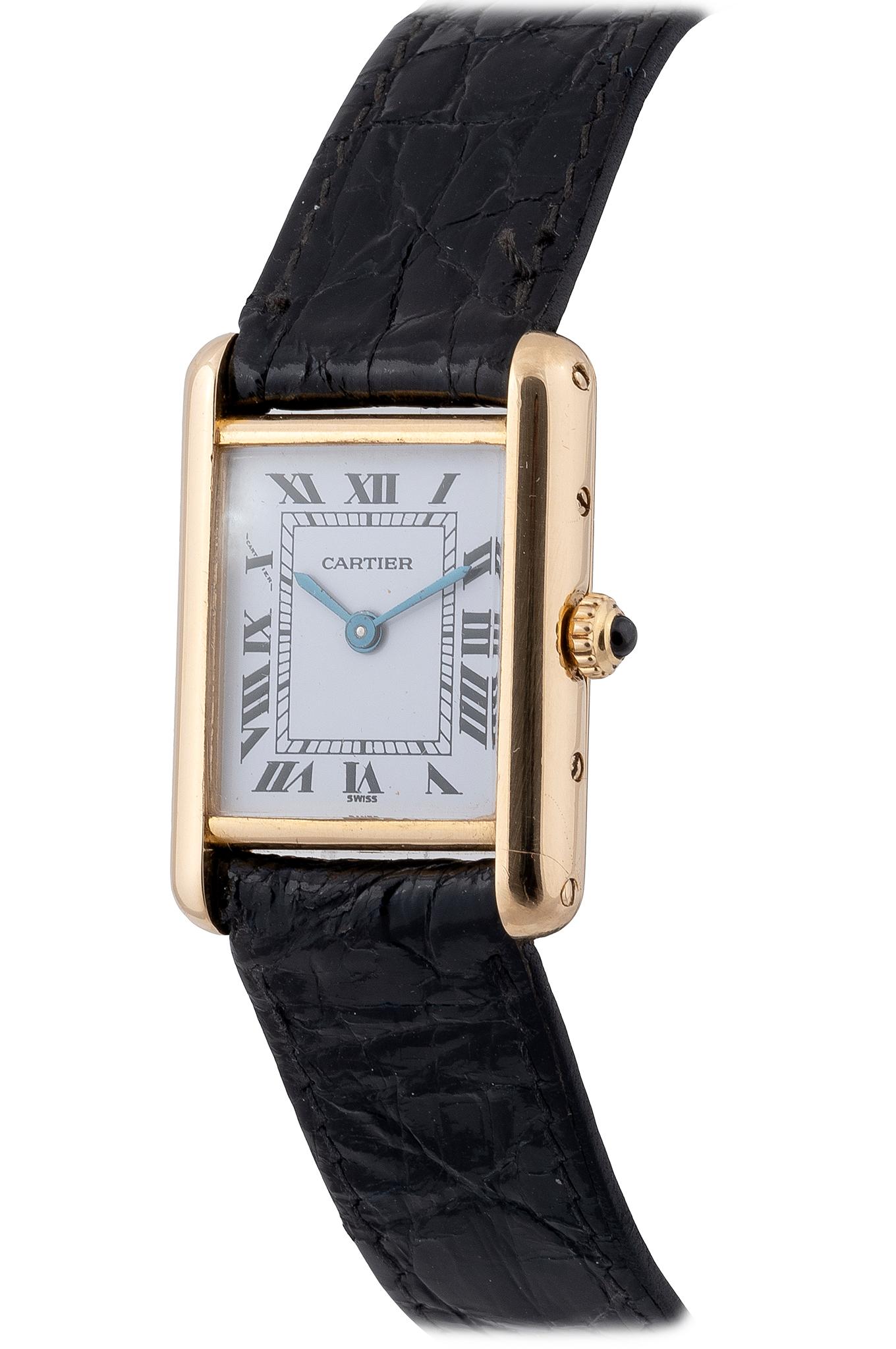 The rectangular ivory coloured dial with Roman chapters, the case plain, to a leather strap with buckle, the dial, case and movement signed Cartier
Size 28mm x 22mm
