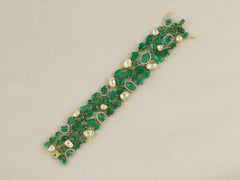 An 18K columbian emerald bracelet set with natural diamonds and polki