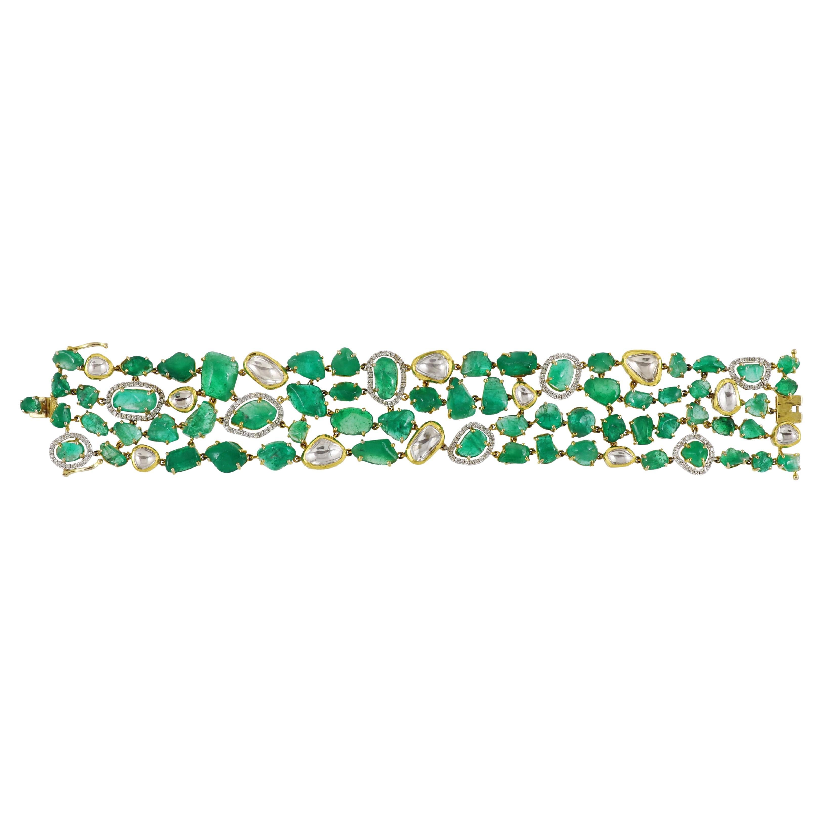 Tumbled An 18K columbian emerald bracelet set with natural diamonds and polki For Sale