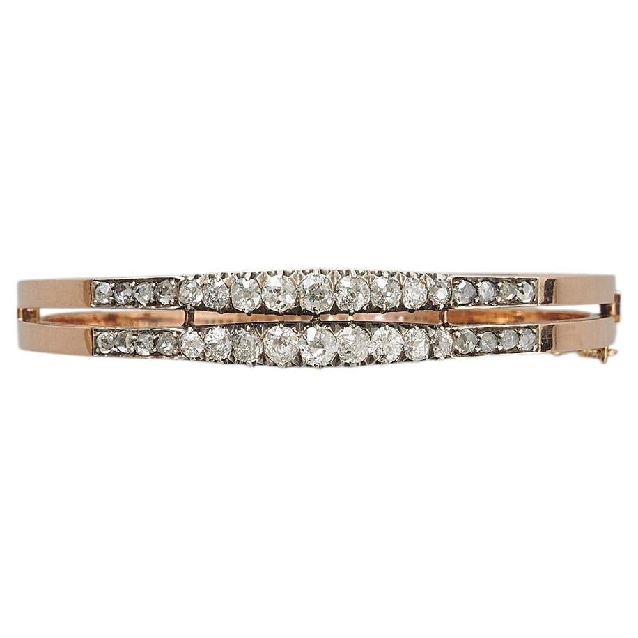 An 18K French Victorian Bangle with Diamonds set in Silver