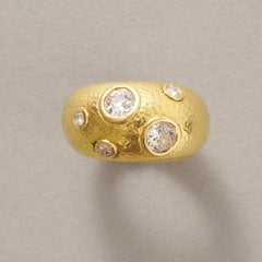 An 18k Gold and Diamond Dome Ring