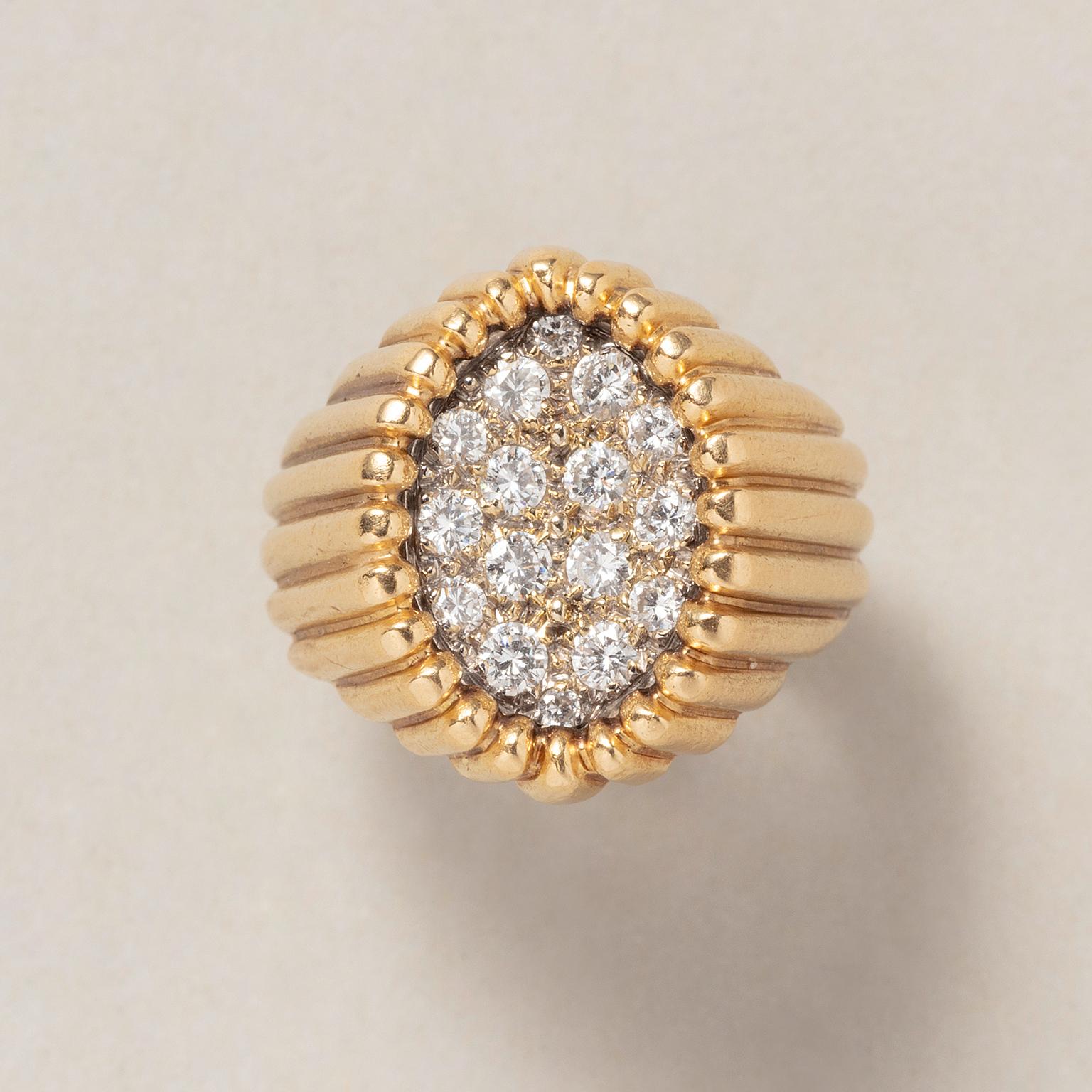 An 18 carat yellow gold tartelette ring set with sixteen brilliant cut diamonds different sizes (app. 0.4 carat, H, Vs) set in a half folded, white gold navette shape, signed and numbered: Mellerio, 6950 3105, France, circa 1970.

weight: 9 g
size: