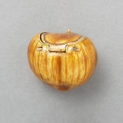 An 18k Gold and Enamel Gucci Hazelnut Pill Box